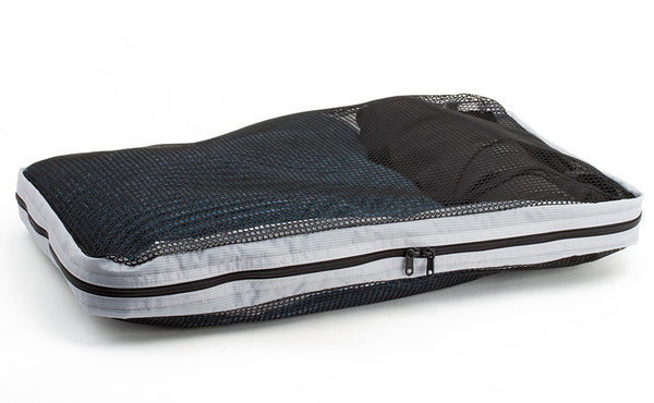 A full, closed Large Tri-Star Packing Cube in Northwest Sky (light grey) 120 Aether.